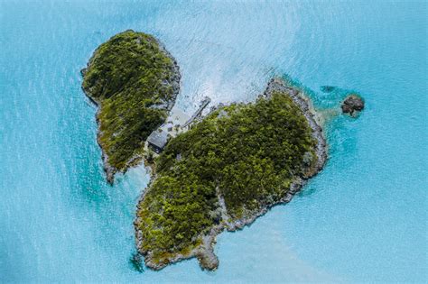 Aerial View of Island Surrounded by Blue Water · Free Stock Photo