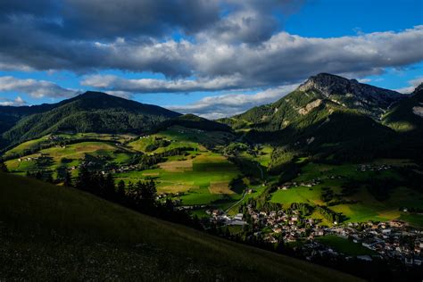 Aerial Photo of Two Mountains Distant from Group of Houses · Free Stock ...