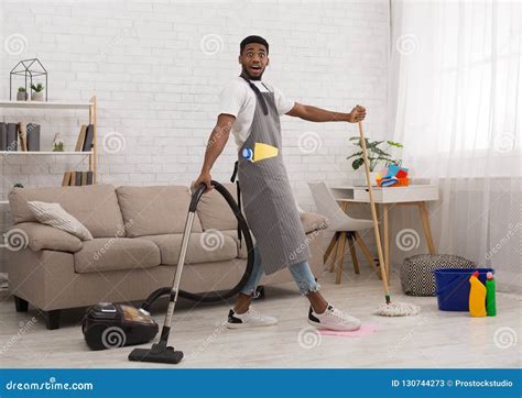 Black Man Cleaning Floor with Vacuum Cleaner and Mop Stock Image - Image of housework, janitor ...