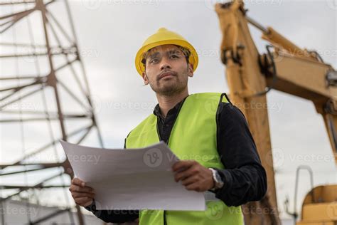 engineer man working in building site. Young Worker man working in construction site ...