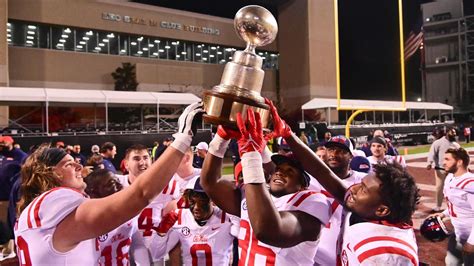 Ole Miss hoists Egg Bowl trophy high after downing Mississippi State ...