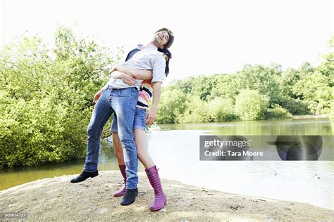 Woman Lifting Man In Air High-Res Stock Photo - Getty Images