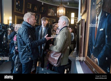 ARTEMIS FOWL, from left: director Kenneth Branagh, book author Eoin Colfer, on-set, 2020. ph ...