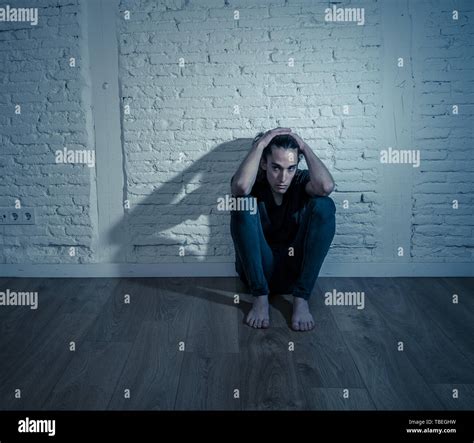 Devastated depressed millennial man crying sad feeling hurt suffering Depression. Teenager ...