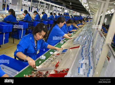 female workers on the assembly line at the chint group low voltage electrical appliance factory ...