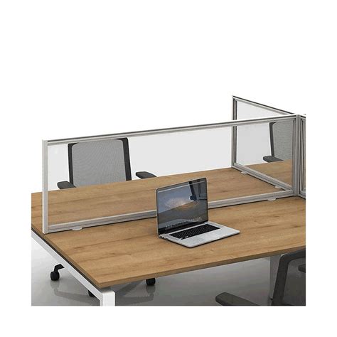 an office desk with a laptop on it