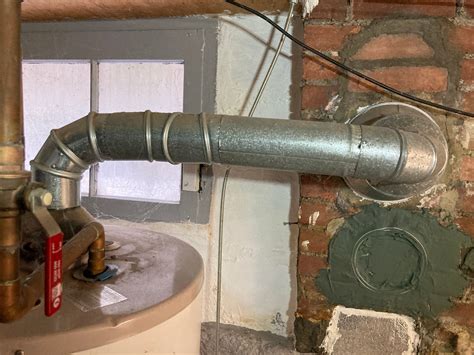 Natural gas hot water heater vent pipe pitch - InterNACHI®️ Forum