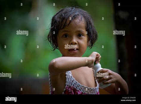 Beautiful young girl drinking milk, Java, Bali, Indonesia, Pacific Ocean, South Asia Stock Photo ...