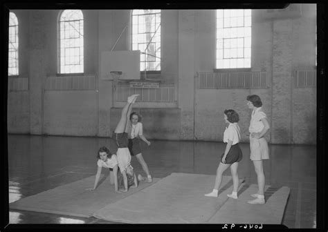 Belle of the Blue; Georgetown College; gymnasium (gym); interior; group of women performing ...