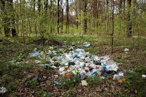 Premium Photo | Pile of garbage dump in the forest. nature environment problems. polluted nature ...