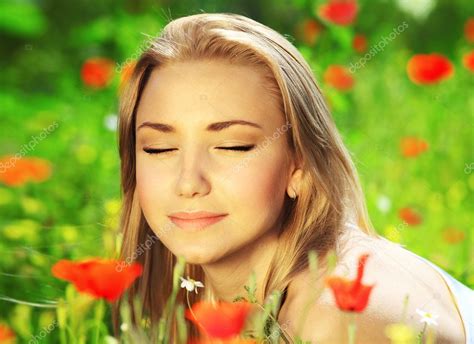 Beautiful female laying on the flower filed Stock Photo by ©Anna_Om 5789173
