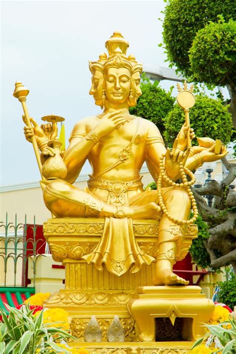 Gold statue of Brahma stock photo. Image of religious - 19087398