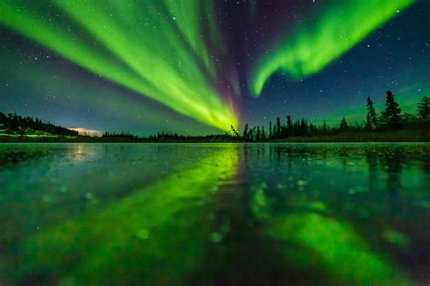 Aurora reflecting on the ice near Yellowknife in Canada last fall! : r/auroraporn