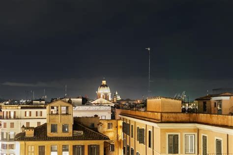 Premium Photo | Rome italy night view of rooftops church domes above traditional lowrise buildings