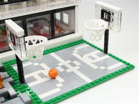 a lego basketball court with an orange ball on it