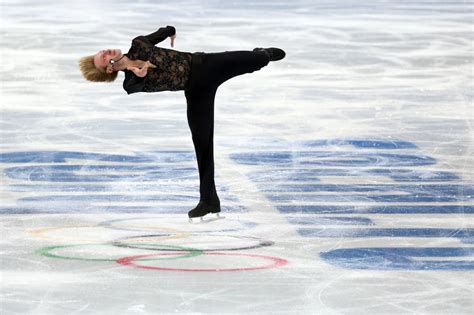 Russian skater Evgeny Plyushchenko leaves men's short program with back ...