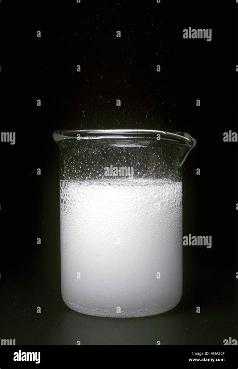 calcium carbonate reacts with dilute hydrochloric acid to produce carbon dioxide Stock Photo - Alamy