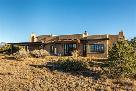 Pueblo-style home fits perfectly into the New Mexico landscape ...