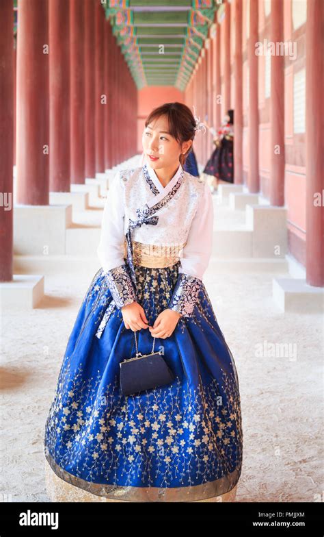 Beautiful Korean woman dressed Hanbok, Korean traditional dress, in ...