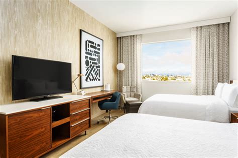 Guest room at the Hampton Inn Santa Monica designed by HBA Studio. Hba Design, Santa Monica ...