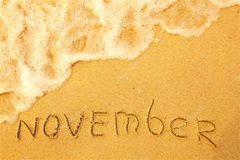 November - written in sand on beach texture — Stock Photo © dimaberkut ...