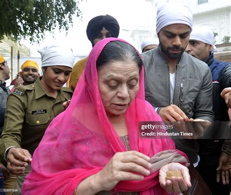 Indian Cricketer Virat Kohli along with his mother Saroj Kohli paying ...