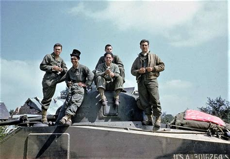 American tank crew one member sporting a top hat resting on the way ...