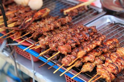 Satay sticks at a market in Bangkok, Thailand. Cantonese Food ...