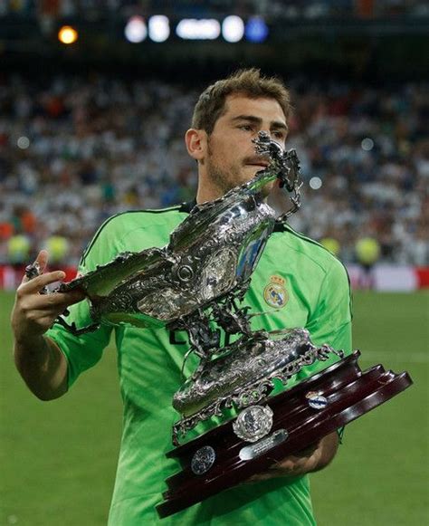 Iker Casillas with the trophy after the match (22/8/13) Wedding Quotes ...