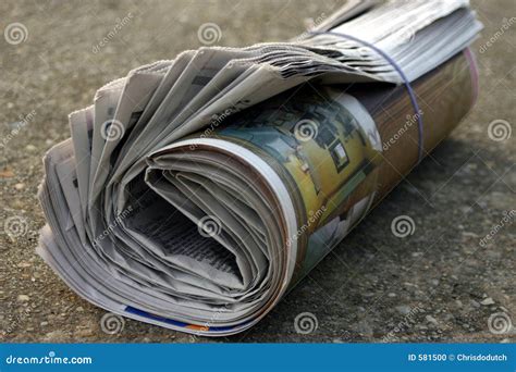 Rolled up newspaper stock photo. Image of driveway, advertizement - 581500