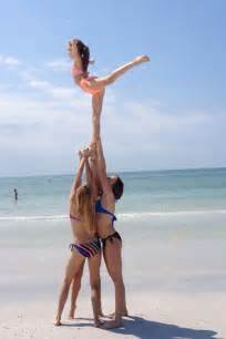 On the beach | Cool cheer stunts, Cheer team pictures, Cheer pictures