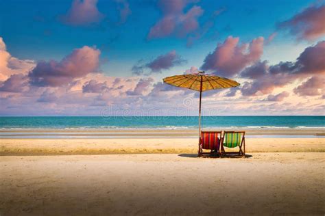 Beach Chairs on the Sand Beach with Dramatic Sky at Sunset Stock Photo ...