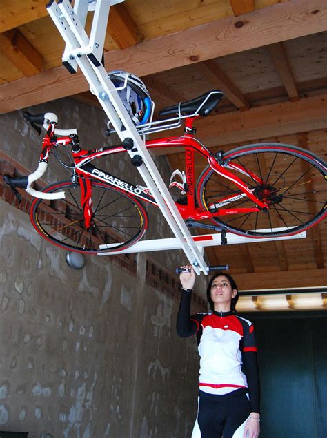 flat-bike-lift enables bikers to store their bike safely in the ...