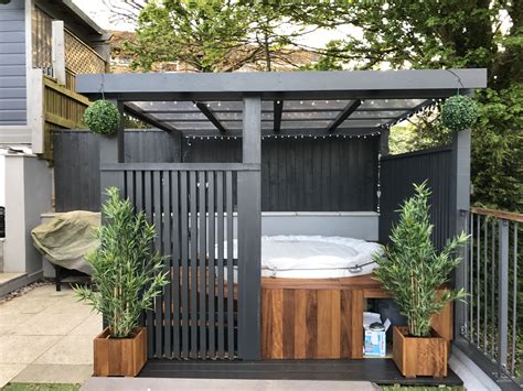 Modern grey pergola.Lazy spa hot tub, iroko surround | Hot tub backyard, Hot tub landscaping ...