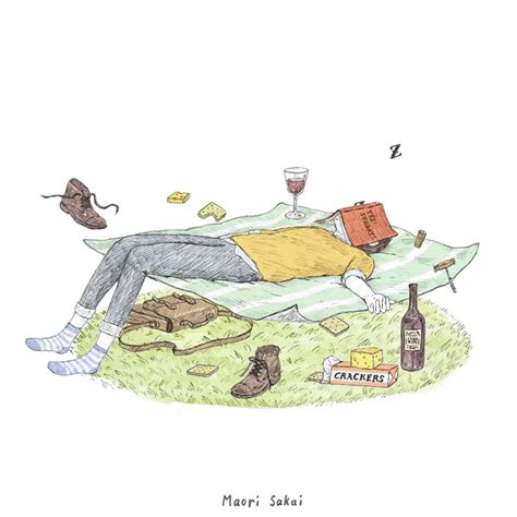 a man laying on top of a grass covered field next to a bottle of wine