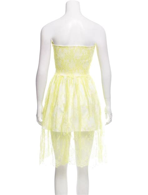 Yellow Valentino strapless lace dress with floral lace pattern throughout featuring smocking and ...