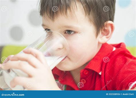 Little Cute Boy in a Red T-shirt Drinking a Glass of Milk. Child Drinking Milk Stock Photo ...