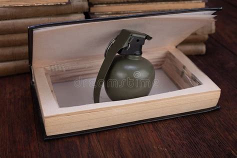 Hand Grenade Hidden in a Book Stock Photo - Image of grenade, case: 191947970