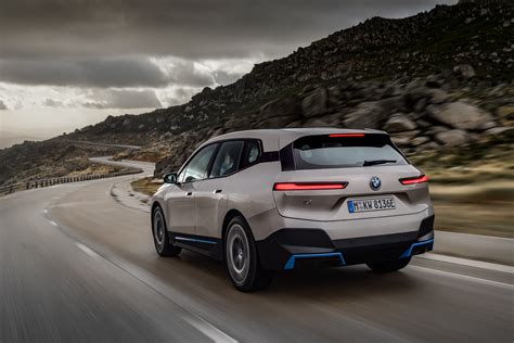 BMW launches its new flagship iX electric SUV with 300 miles of range ...