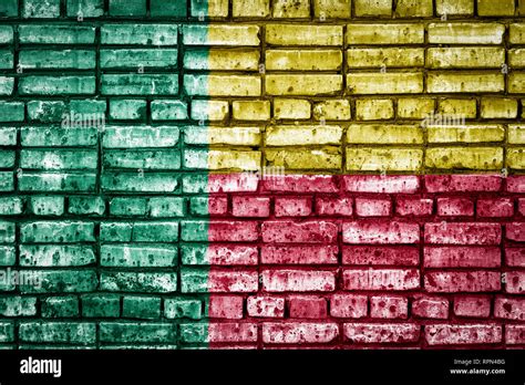 National flag of Benin on a brick background. Concept image for Benin: language , people and ...