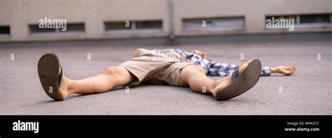 man on the ground, got injury outdoors, falling down Stock Photo - Alamy