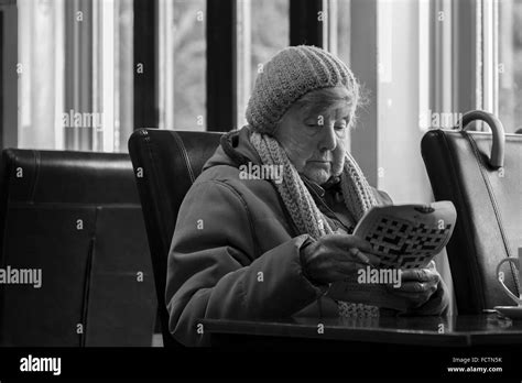 Crossword puzzle older women Black and White Stock Photos & Images - Alamy