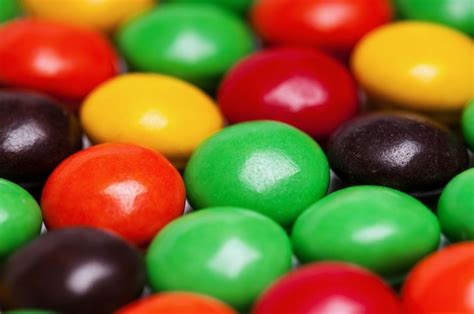 Premium Photo | Background of colorful candies coated chocolate sweets