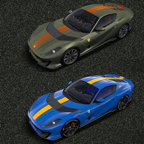 two sports cars are side by side on the road, one is blue and yellow
