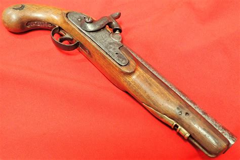 1840s British Brown Bess musket converted tower percussion pistol. Features walnut stock and grip