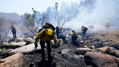 Firefighters gain on California wildfires despite high heat