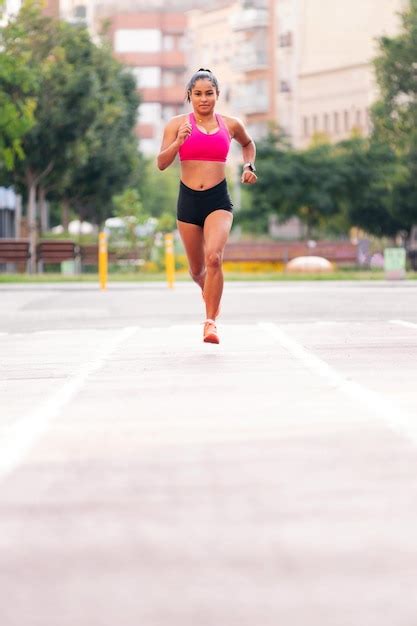 Premium Photo | Female athlete running during her training at city