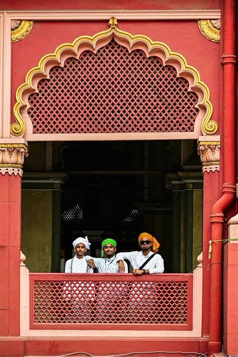 Three Men Wearing Turbans Standing Together on a Balcony inside the ...