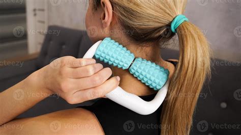 Woman massaging herself with body roller. Neck massage. Prevention of neck pain 5479088 Stock ...