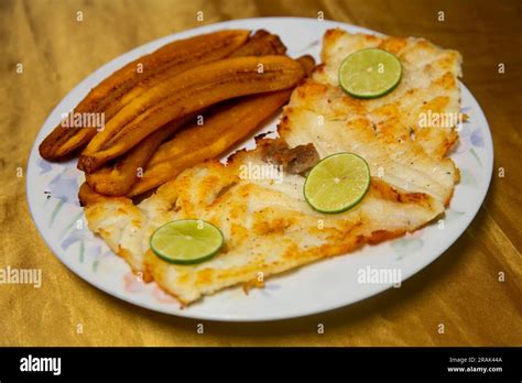 Grilled paiche fish with roasted banana. Typical Peruvian jungle dish ...